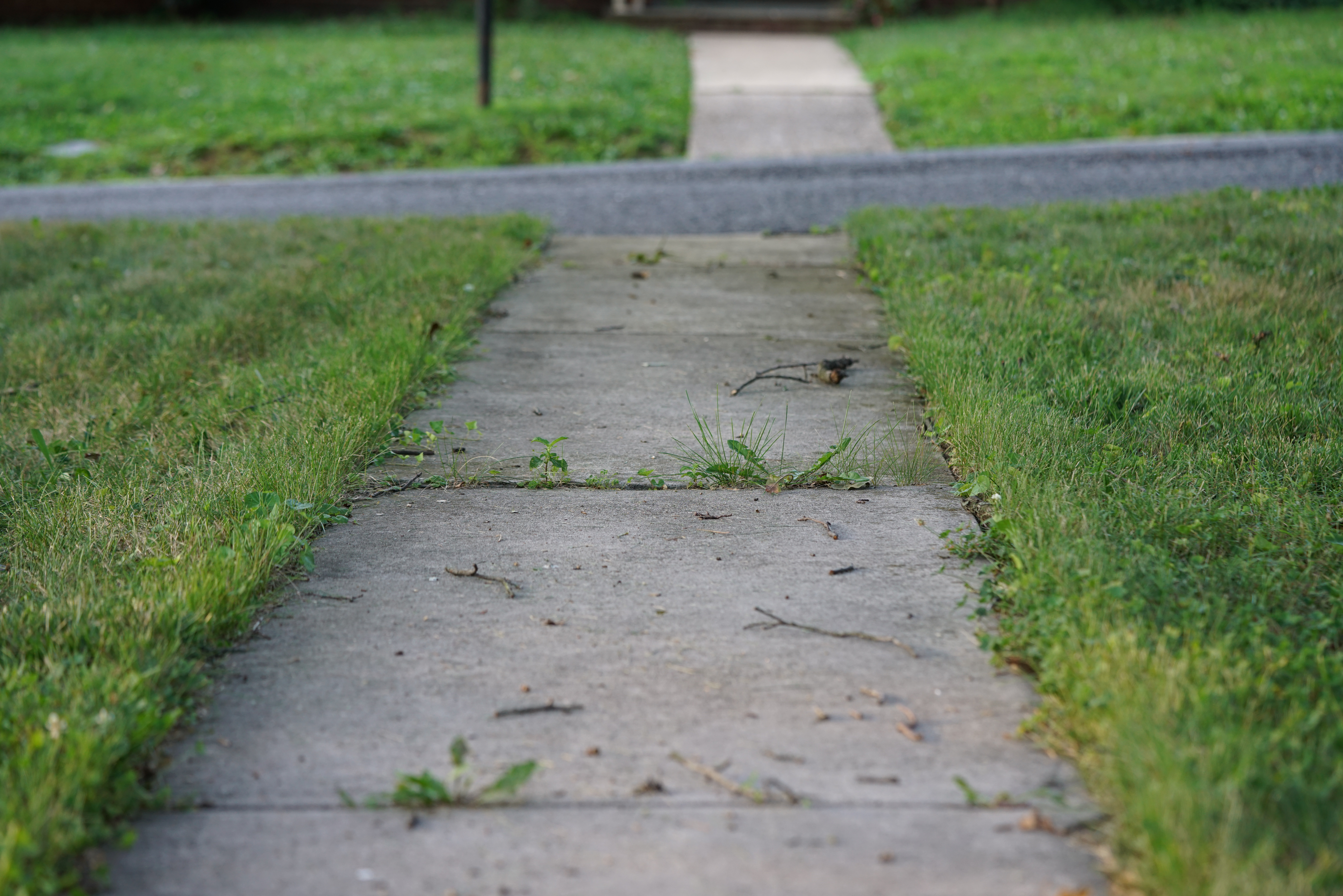 Before Cracked walkway to beautiful paver patio transformation Chattanooga TN